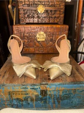 L’Idea Gold Pointed Slingback Heels with Decorative Bow